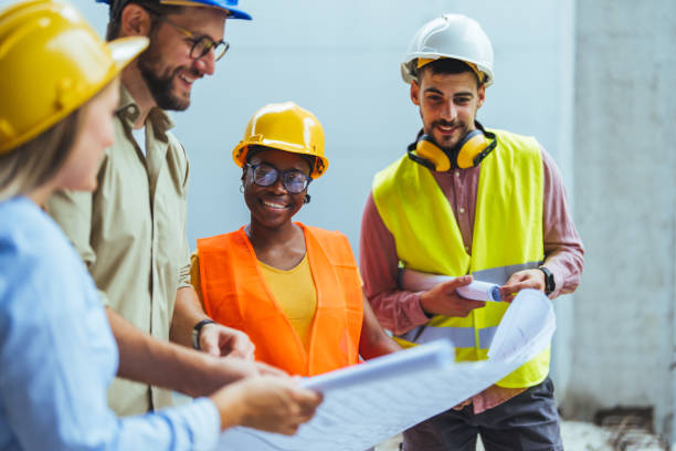 istock Team of architects and civil engineers inspecting construction site. 1852613200