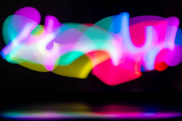 istock Rainbow abstract play of light over black surface in the dark 1852631352