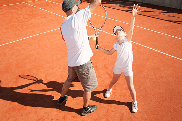istock Tennis coach with junior female talent 185263500