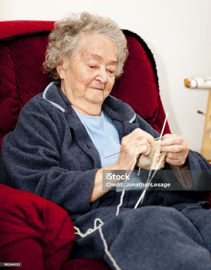 proud grandmother knitting mitts proud grandmother showing her knits Grandmother Stock Photo