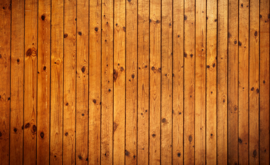 notches, hacks and holes in the old rough surface of wood from the bark of a tree for a rural background