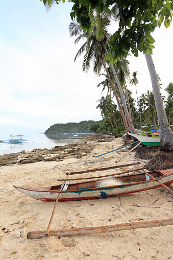 Fishing boats stranded on the beach near El Nido, Palawan Island, Philippines