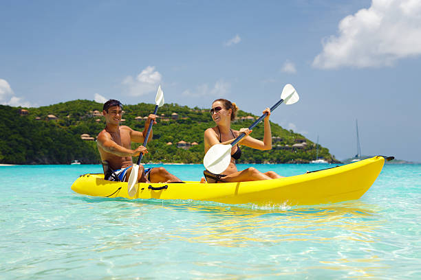 young couple kayaking in the Caribbean