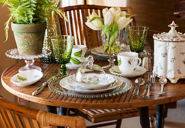 Pretty Table Setting A springtime table setting in natural light. tea party horizontal nobody indoors stock pictures, royalty-free photos & images