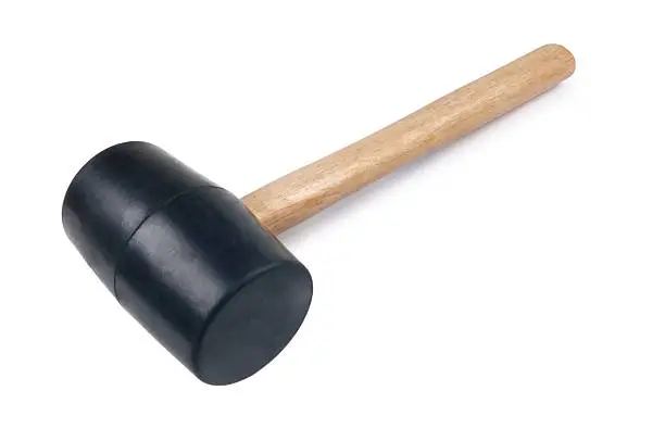 Rubber headed mallet with wooden handle isolated on white.