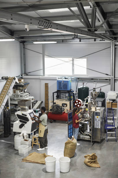 istock Industrial Machines in Workshop at Coffee Factory With People Working 1852647911