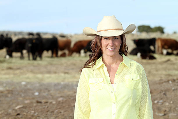 istock Cowgirl with her cattle herd 185264932