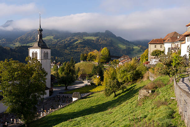 istock gruyere's church and hillside 185265450