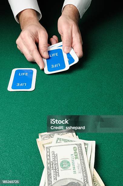 Life Card Game With Money Stock Photo - Download Image Now - Casino Worker, Concepts, Concepts & Topics