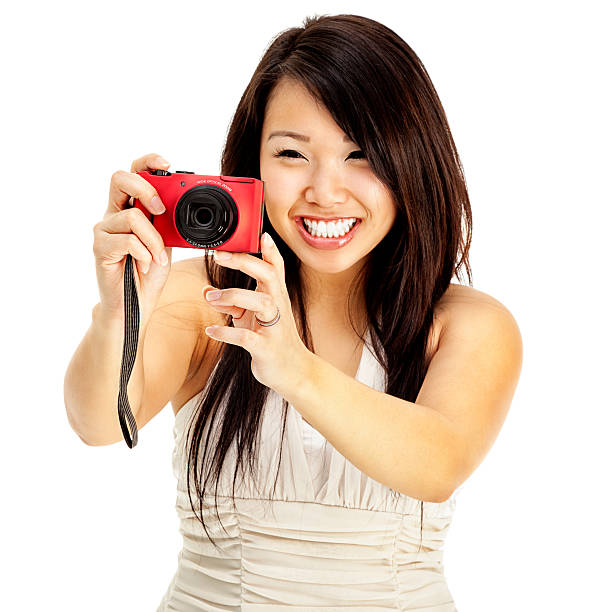 istock Attractive Young Asian Woman Having Fun with Digital Camera 185266441