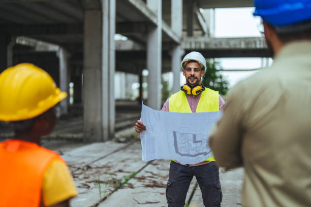 istock Diverse Team of Specialists Taking a Walk Through Construction Site. 1852665827