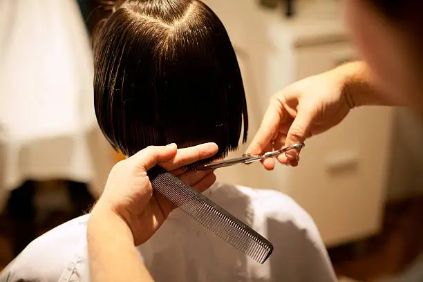 Cutting hair at the hair studio