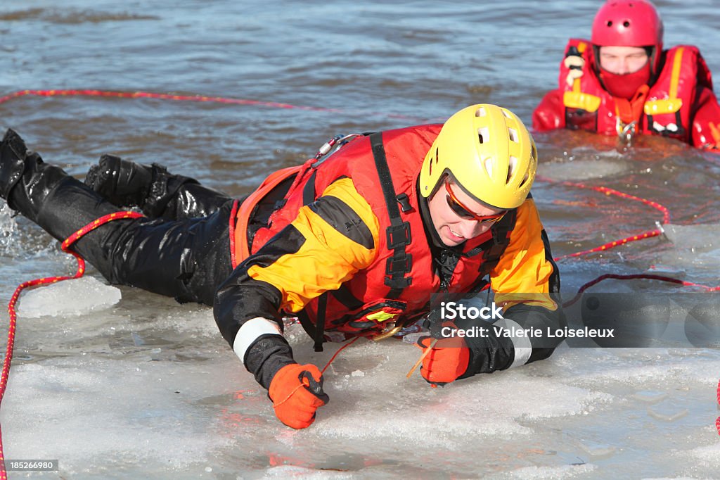 Ice water rescuers - Foto stock royalty-free di Salvataggio