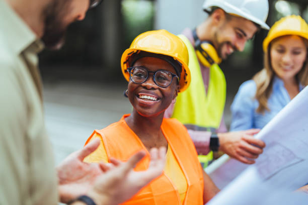istock Comparing with the blueprints, a team of experts is evaluating the realization on the construction site. 1852670181