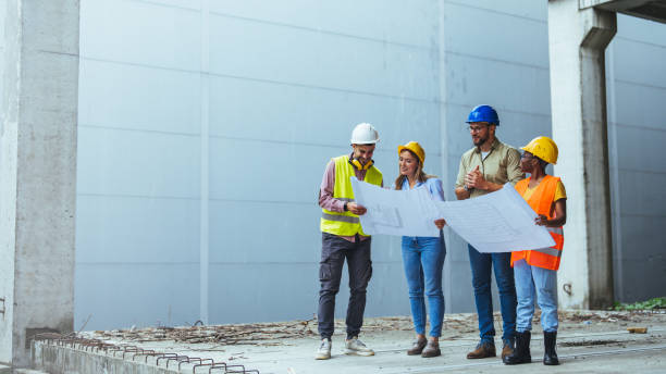 istock Diverse Team of Specialists Taking a Walk Through Construction Site. 1852671753
