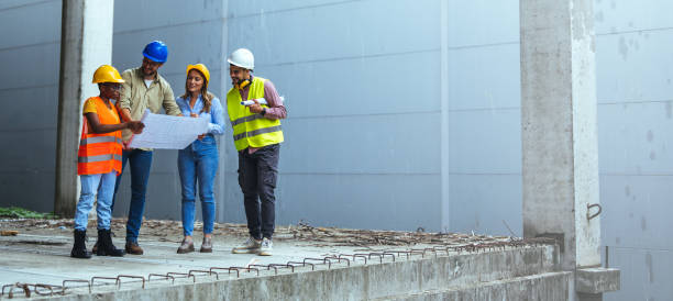 istock Team of architects and civil engineers inspecting construction site. 1852671772