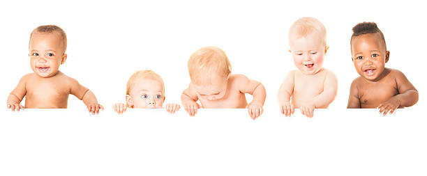 Baby Banner Cute babies having fun together. Looking down at your advertisement. Please checkout our other baby images which are totally interchangeable with these babies: babies only photos stock pictures, royalty-free photos & images