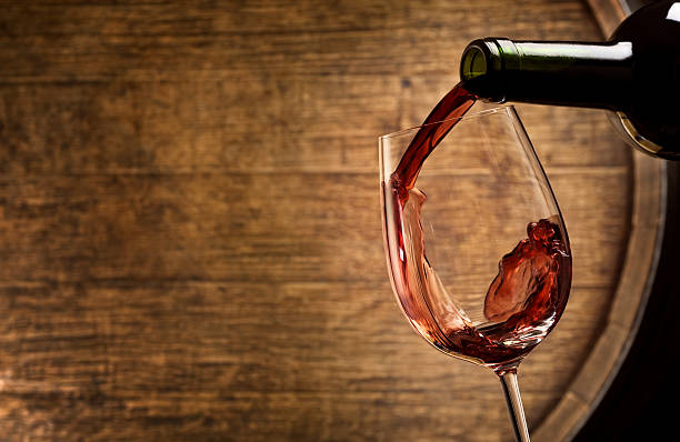 weinprobe im weinkeller - wine wineglass red wine pouring stock-fotos und bilder