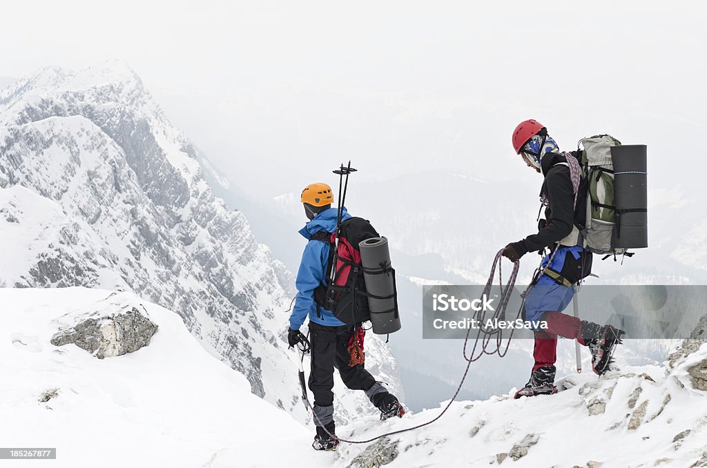 team of alpinists team of alpinists roped together Footpath Stock Photo
