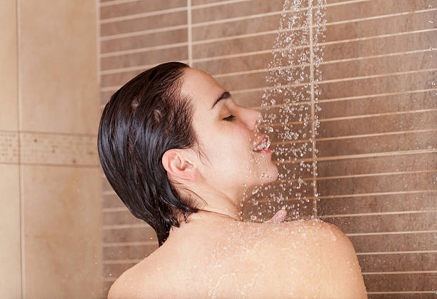 istock Sensual woman taking a shower 185268012