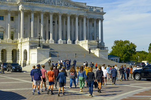 Washington D.C., January 30, 2021:  Fences were erected around Capitol after January 6 when pro-Trump protesters rallied in DC ahead of Electoral College vote count and some stormed into the Capitol. Visitors have to stay outside the fence to view the Capitol.