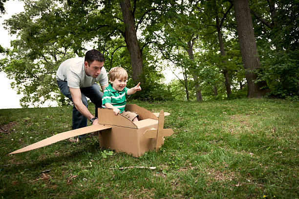 istock Little Boy in a Cardboard Plane 185268098