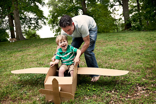 istock Little Boy in a Cardboard Plane 185268099