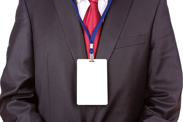 Photo of a Black male airport security workers credentials.