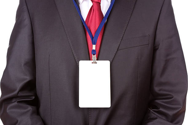 Front shot of a businessman wearing a blank name tag stock photo