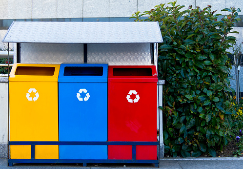 Collection of waste bins full of different types of garbage, recycling and separate waste collection concept