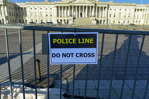 Police Line - Do Not Cross placard at the Capitol building in Washington DC