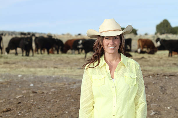 istock Beautiful Young Woman on her cattle ranch 185268946