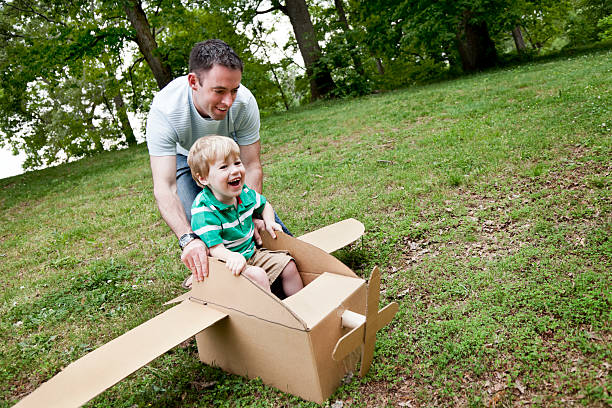 istock Little Boy in a Cardboard Plane 185269513