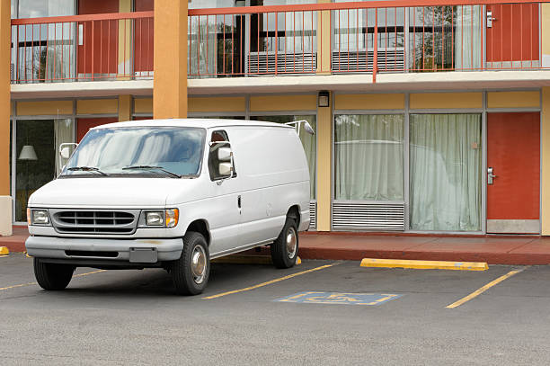 Motel Doors and Parked White Van Close Up