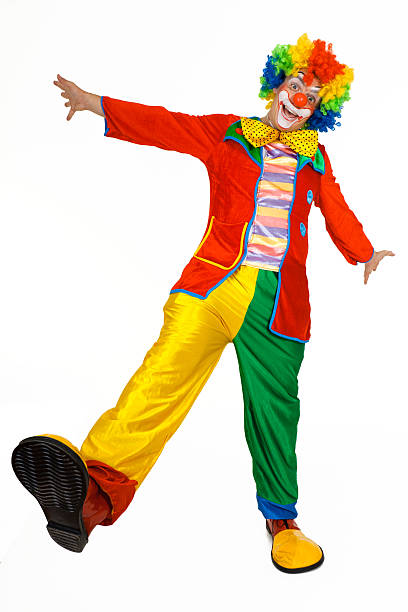 Funny clown standing with hands outstretched.Funny clown in colorful costume standing with hands outstretched and singing.