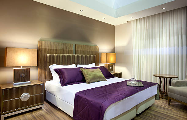 Contemporary bed in white interior.