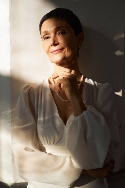 istock Senior Bride Wearing White Dress in Sunlight and 1852701431