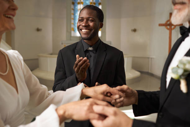 istock Smiling Black Man as Priest Officiating Wedding in Church 1852701432