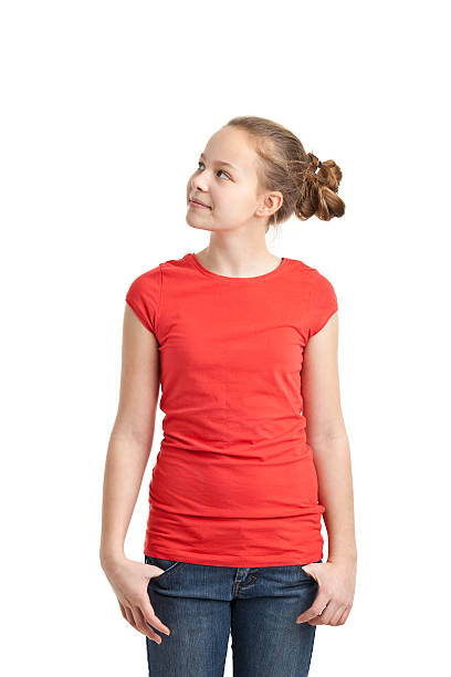 szczęśliwy nastolatka na czerwono t-shirt - little girls pre adolescent child standing isolated zdjęcia i obrazy z banku zdjęć