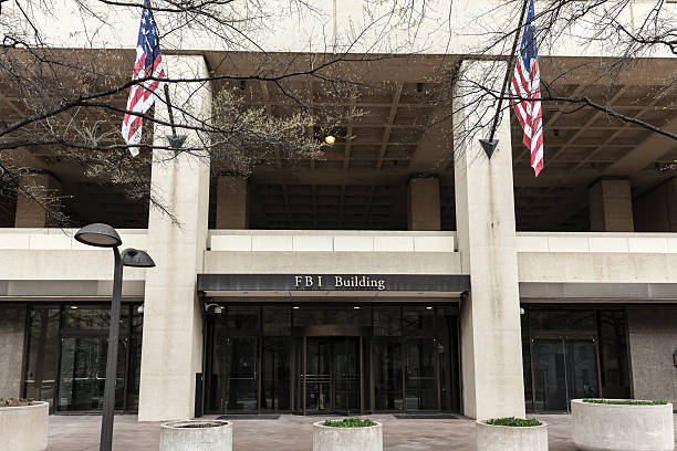 istock FBI Building Entrance Flanked by Flags 185270584