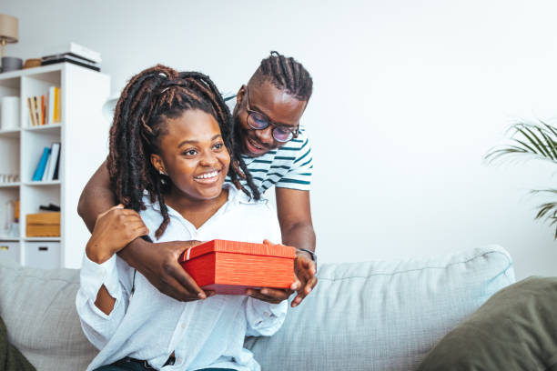istock Happy young diverse couple celebrating Valentine's day together 1852708435