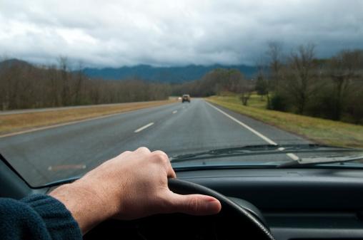 Hand on the wheel of a car, driving in rural North Carolina near Bryson City.