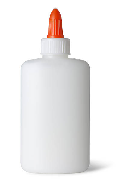 Glue Bottle on White This is a photo of white craft glue isolated on a white background with a drop shadow.Click on the links below to view lightboxes. glue photos stock pictures, royalty-free photos & images