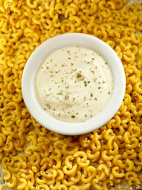 alfredo salsa - italian cuisine dry pasta directly above foto e immagini stock