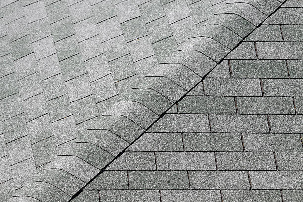 Tiles of a sloping roof Asphalt tiles of a sloping roof wood shingle photos stock pictures, royalty-free photos & images
