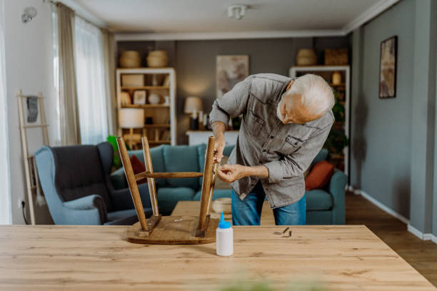 istock Senior man repairing his chair 1852718530