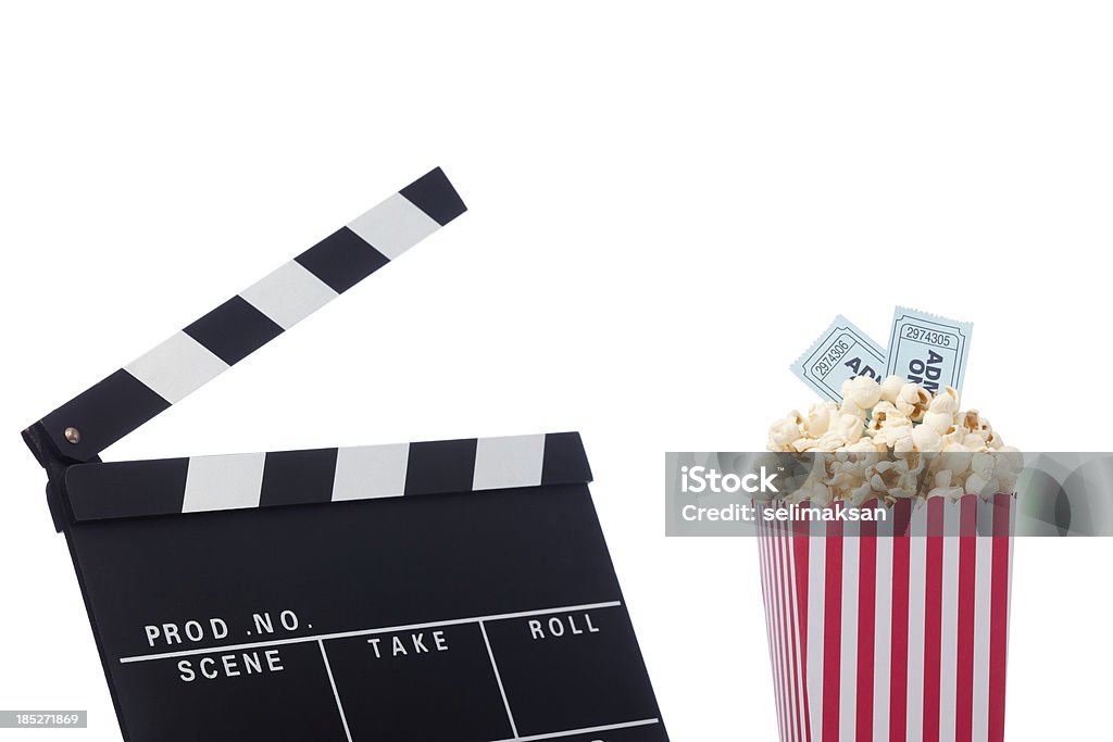 Popcorn, and film slate for cinema concept Popcorn and film slate  for cinema concept Movie Ticket Stock Photo