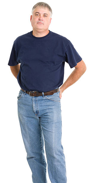 istock Serious Mature Man Standing With Hands Behind Back 185272030