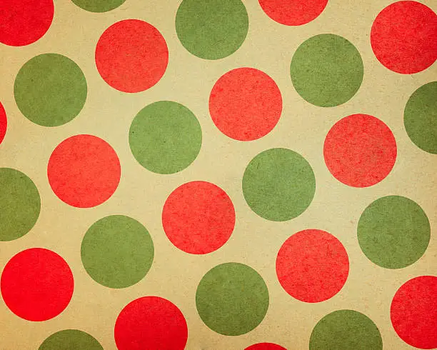 Photo of paper with large red and green dots