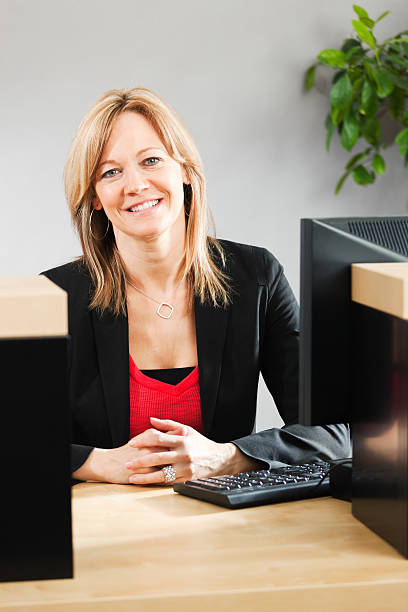 istock Friendly Smiling Bank Teller in Retail Banking Customer Counter Vt 185272355